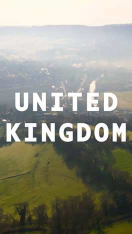 Vertical-Video-Aerial-Drone-Shot-Of-Fields-And-Countryside-In-UK-With-Animated-Graphic-Spelling-Out-United-Kingdom